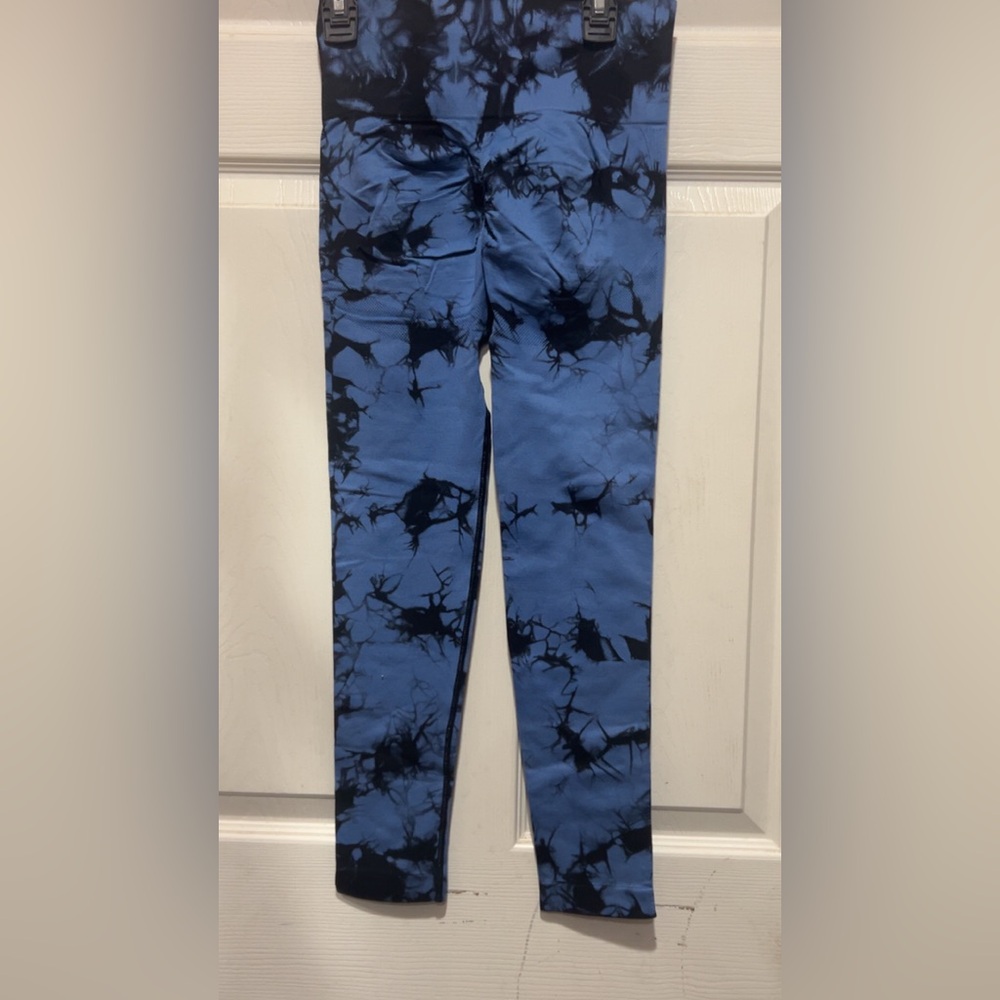 Blue tie-dye leggings with black accents. Size S has a stain #tie-dye #leggings